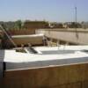 AC (air conditioning) units protected from the Baghdad heat using white, thermal  reflective coatings.